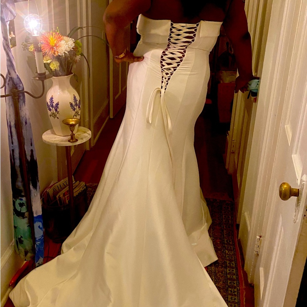 Brand new wedding gown added beading to the train!!